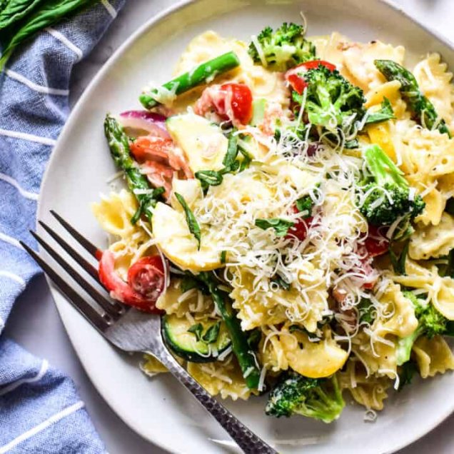 Gluten free pasta primavera with vegetables that grow in the Gulf Coast region in the winter and spring. Recipe by Melissa Huerta